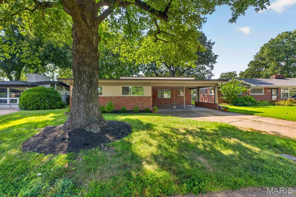 Welcome to this beautifully updated 3-bedroom, 2-full-bath mid-century modern ranch in the architecturally unique Copa Villa cul-de-sac. This home offers comfortable living, stylish updates, and new thermal windows that bring in abundant natural light throughout. Refinished hardwood floors, hardware and fresh paint create a bright, inviting atmosphere.
The spacious living room features clerestory windows and large, newer Pella double-sliding doors with integrated blinds that overlook the backyard. The updated 2022 kitchen showcases white cabinetry, granite countertops, a stylish backsplash, and stainless-steel appliances, including a gas stove and cooktop, refrigerator with ice maker, and disposal, plus a new 2026 microwave and dishwasher. A separate dining room flows seamlessly from both the kitchen and living room, making everyday living and entertaining effortless. 
All three bedrooms are generously sized, providing plenty of comfort, light, and flexibility. The lower level includes a partially finished basement and washer/dryer hookups in the unfinished area, with plenty of storage.   Additional updates include HVAC (2022). Ideally located within walking distance of Ruth Park Golf Course and just minutes from parks, the new Market on Olive shopping district, downtown Clayton shops and restaurants, and major highways.