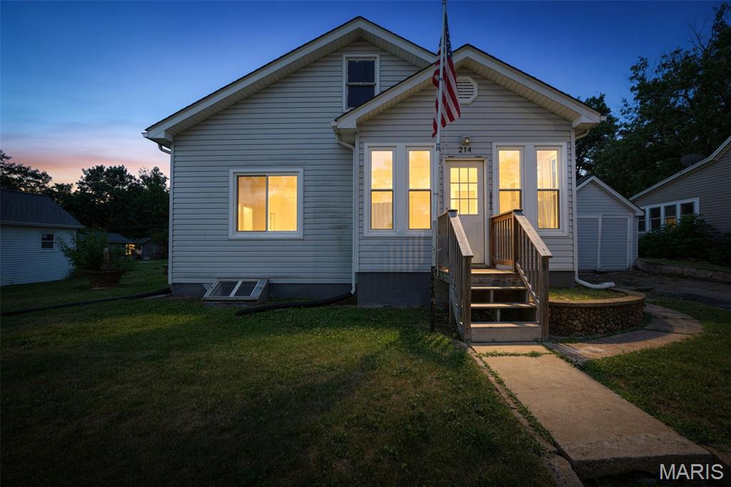 Charming 2-bedroom, 1-bath home offering comfort, character, and plenty of living space! Beautiful hardwood flooring flows through much of the home, while the spacious kitchen features an abundance of cabinetry for all your storage needs. Enjoy both a cozy living room and an oversized family room complete with a wood-burning fireplace—perfect for relaxing or entertaining.  The inviting front sun porch is filled with natural light and features new windows, as do the living and dining rooms. The updated bathroom includes a beautiful walk-in shower for added convenience and style.  Step outside to a private patio area, ideal for outdoor gatherings, plus a detached 1-car garage. Major updates provide peace of mind, including a roof and HVAC system that are only one year old. This home is move-in ready and waiting for its new owner!