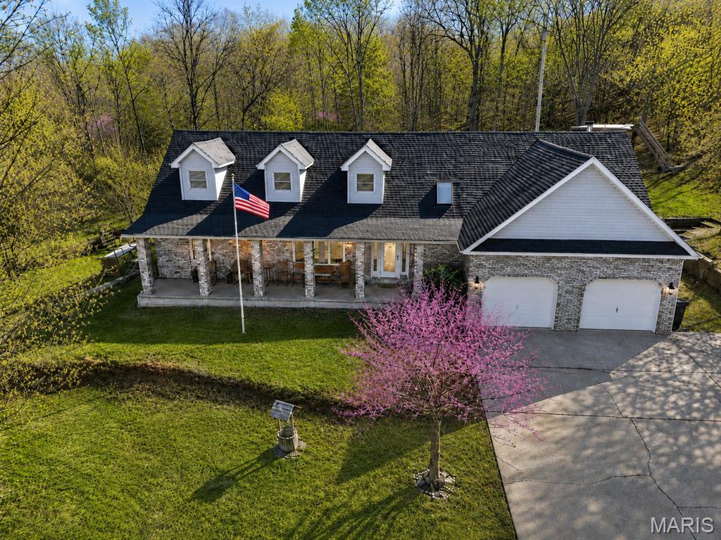Beautifully maintained 1.5-story home located at 1105 Old Route H in Waynesville offering exceptional space, character, and valuable system updates in a highly convenient location. This spacious 5-bedroom, 2.5-bath layout features two bedrooms and 1.5 baths on the main level, along with both a formal living room and a separate family room highlighted by vaulted ceilings, a wood-burning fireplace, and stunning stained-glass skylights that fill the space with natural light. The formal dining room also showcases vaulted ceilings and skylights, creating a warm and inviting setting for gatherings. The generously sized kitchen includes a center island and abundant cabinetry for both storage and everyday functionality.

Upstairs, you’ll find three additional bedrooms, a versatile bonus room ideal for an office or flex space, and a full bathroom, offering room to grow and adapt to your needs. Major recent improvements provide peace of mind, including a brand-new roof (2026) and two new HVAC units (2024), along with fresh paint throughout much of the home.

Ideally positioned within walking distance to Waynesville Middle School, the 6th Grade Center, and Waynesville High School, this home also offers close proximity to Phelps Health, the local movie theatre, Waynesville Career Center, fitness centers, dining, and shopping opportunities—making daily life both convenient and connected. Enjoy outdoor living from the covered front porch or count the stars from the enchanting tree fort platform. Plus enjoy the added storage with a backyard shed. This property delivers comfort, charm, and location all in one.