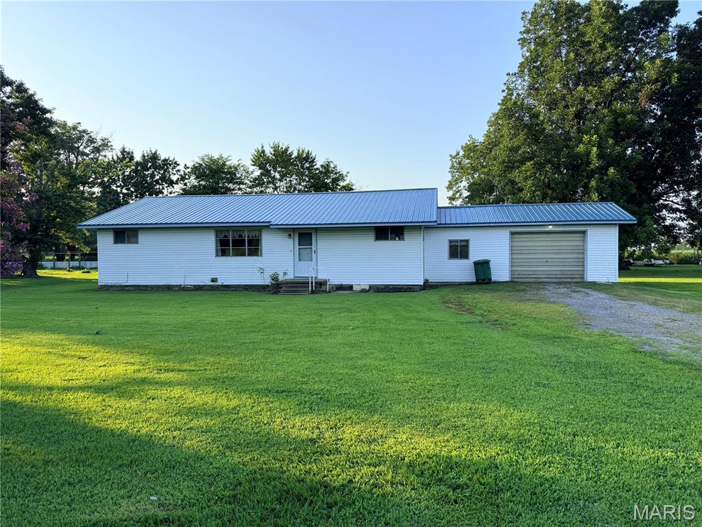 This 3 bedroom, 1.5 bath home is located just outside city limits and features large bedrooms and a large dining room. Metal roof was new in 2024. If you want to put your own stamp on your home, this property could be the right one for you.  Home is listed below appraised value so call today and make your appointment to view this home.