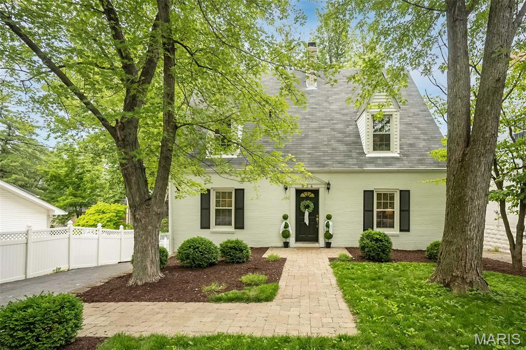 Charming English cottage just steps from the heart of Kirkwood. Enjoy an easy walk to downtown shops and restaurants, the Kirkwood Farmers' Market, and neighborhood favorites that make this one of St. Louis ' most sought-after communities. Inside, classic architectural details blend seamlessly with thoughtful updates. The center-hall floor plan welcomes you with a spacious living room featuring a gas fireplace, custom built-in bookcases, and French doors that fill the space with natural light. Additional French doors open to a freshly refinished private deck and a large patio, creating the perfect setting for morning coffee, outdoor dining, or entertaining friends. The updated kitchen offers stainless steel appliances, granite countertops, a breakfast bar, and newer flooring in the adjoining dining room. A main-floor laundry room and powder room provide everyday convenience.  Upstairs, you'll find three comfortable bedrooms and a full bath. The finished lower level expands the living space with a family room, gas fireplace, sleeping area, full bath (ideal for guests), and room for a home office.
Outside, refreshed landscaping enhances the home's curb appeal, while abundant storage includes additional space beneath the deck.

Home has passed Kirkwood Occupancy Inspection. Fireplaces are offered in as-is condition.