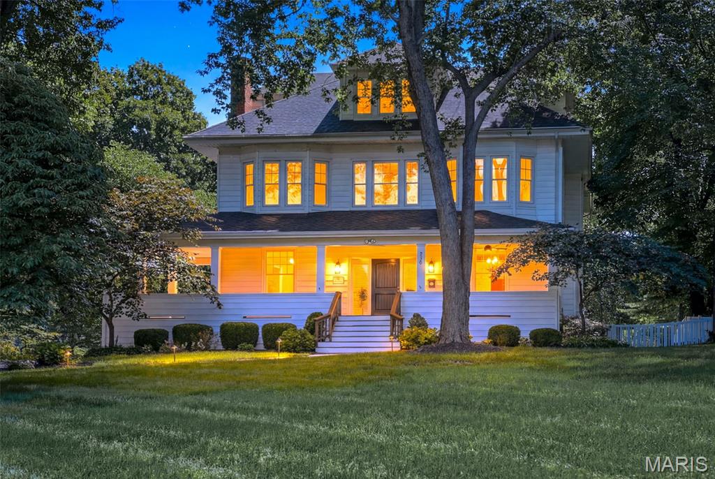 Timeless elegance, exceptional space, and an unmatched Webster Groves lifestyle come together in this stunning luxury residence set on a beautifully landscaped lot along one of the community's most coveted streets. Offering over 5,000 square feet of thoughtfully designed living space, this home seamlessly blends classic character with modern sophistication. A stately wrap-around porch greets you, and inside, rich hardwood floors, high-end finishes, and quality craftsmanship are showcased throughout — creating warm, inviting spaces that are both elegant and functional. A spectacular 1,700+ square foot addition completed in 2019 transformed the home with an expansive family room featuring a wall of French doors and transom windows, a stunning chef-inspired kitchen with a Thermador built-in 48" side-by-side fridge/freezer, 48" cooktop with 6 burners and griddle, massive 10' x 8' island, and quartz countertops, and a luxurious primary suite with double vanities, two walk-in closets, soaking tub, expansive walk-in tile shower with dual shower heads and pebble stone floor, and a sitting room — all designed for everyday comfort and effortless entertaining. With six bedrooms including two private primary suites, four full baths, and two half baths, the home offers remarkable flexibility for families, guests, or work-from-home needs. Generous gathering spaces invite connection, while private retreats provide comfort and tranquility. Enjoy morning walks beneath mature trees, evenings entertaining friends and family inside or out on the low-maintenance deck, and the convenience of being just moments from the charming shops, acclaimed restaurants, and vibrant community atmosphere of Old Webster. The home sits along the beloved July 4th parade route — one of Webster Groves' most cherished traditions — placing you at the heart of the community year-round. Whether dining on a neighborhood patio, browsing local boutiques, or taking part in the area's beloved events, this location places the very best of Webster Groves at your doorstep. More than just a home, this is a rare opportunity to enjoy luxury living in a storied neighborhood.