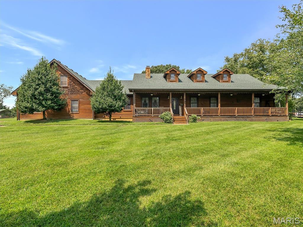 Discover luxury, space, and craftsmanship in this stunning 3,600+ sq ft custom home situated on 3.4 picturesque acres. Offering 3 spacious bedrooms, 3 full bathrooms, and a versatile bonus room perfect for a home office, guest space, gym, or playroom, this property was designed with both comfort and functionality in mind.

Step inside to find exceptional custom millwork, beautiful solid wood cabinetry, custom closets, and high-end finishes throughout. The inviting living area features a breathtaking floor-to-ceiling stone fireplace that creates the perfect focal point for gathering and entertaining.

The oversized chef’s kitchen is sure to impress with abundant cabinetry, expansive counter space, and a large custom center island ideal for cooking, hosting, and everyday living. A functional mud room and attached 3-car garage add convenience and practicality.

Outside, the property truly stands apart with an impressive climate-controlled outbuilding featuring three garage bays, poured concrete floors, electric, and water—perfect for a workshop, hobby space, business equipment, additional storage, or recreational vehicles.

With the perfect blend of luxury, acreage, storage, and usable space, this one-of-a-kind property offers endless possibilities for entertaining, hobbies, and peaceful country living while still providing modern convenience.

Schedule your private showing today and experience everything this exceptional property has to offer.