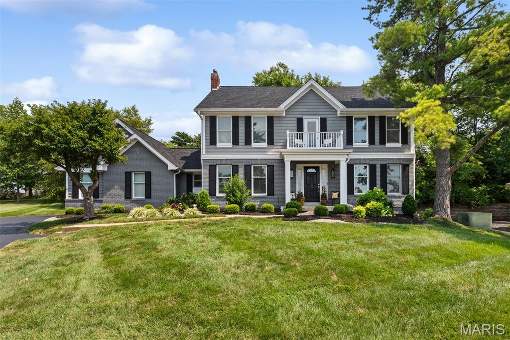 Discover an exceptional lifestyle in this beautifully updated home nestled within a gated enclave in sought-after Town & Country, offering peaceful serenity, resort-style amenities, and the coveted Mason Ridge School. Ideally situated on a quiet cul-de-sac, this former display home features tall ceilings, large crown molding and an inviting open floor plan designed for both everyday living and effortless entertaining. 

The heart of the home is the spacious gourmet kitchen, featuring center island with breakfast bar, light cabinetry, granite countertops, full backsplash, stainless-steel appliances, hardwood floors, breakfast bar, and a large eat-in area that opens seamlessly to the hearth room/family room. Hearth room features a beautiful woodburning fireplace with full brick hearth, custom built-ins, and wet bar with additional seating, creating a warm and welcoming gathering space, while the adjacent sunroom provides an abundance of natural light and additional room to relax or entertain. French doors connect the sunroom to the hearth room and kitchen, sliding glass doors open to a fabulous covered, stamped-concrete patio and outdoor dining area buffered by the tranquil wooded backdrop, and also includes a covered hot tub. The stylish dining room features hardwood floors and a designer chandelier, with convenient access to the kitchen and adjacent wine room/living room. The updated primary suite is a true retreat, showcasing triple crown molding, large windows, a walk-in closet, plus a second closet, and a private balcony overlooking the front yard. The stunning, beautifully renovated primary bath features a designer soaking tub, separate shower, double vanity, quartz countertops, designer faucets and lighting, and large windows. Partially finished lower level offers additional flexible space for recreation, gaming, hobbies and loads of storage space in the unfinished portion. Outside, the cozy backyard extends toward a peaceful, wooded area, creating a private and serene setting. 

Enjoy the exceptional resort-like amenities and carefree lifestyle of this secure, gated community, including a resort-style pool, pickelball, tennis, basketball, clubhouse, large pond, paved walking trails, community events, attended gatehouse, and comprehensive lawn and property services. Beyond amenities, the HOA also includes lawn mowing, tree and shrub maintenance, sprinkler service, snow removal, and trash service. 

Conveniently located near Highway 40 and 141, with easy access to Clayton and all that West County has to offer, this home combines sophisticated living, thoughtful updates, exceptional community amenities, and the style and convenience of Town & Country living.