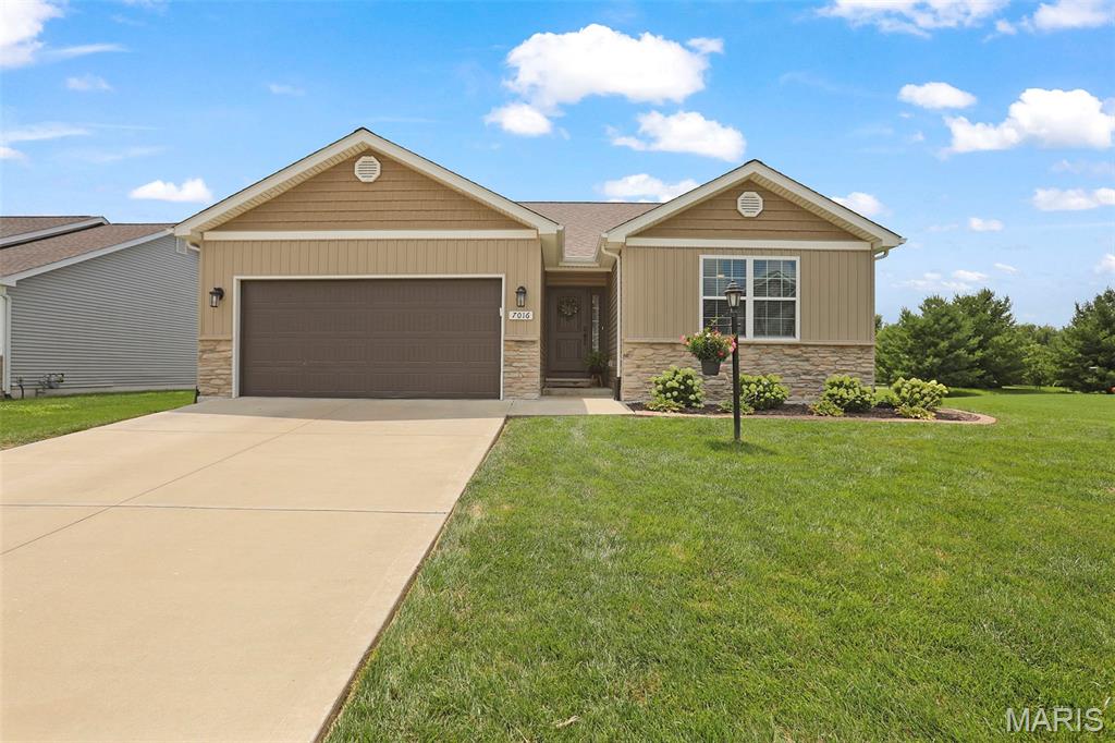 Welcome home to this beautifully updated, move-in ready ranch in the highly desirable Savannah Crossing Subdivision! Offering the perfect blend of modern style and everyday comfort, this home features charming Craftsman curb appeal with board and batten, shake, and stone accents. Step inside to an open, airy floor plan highlighted by vaulted ceilings, fresh paint throughout, updated lighting, and new luxury vinyl flooring that flows through the main living areas. The stunning kitchen is truly the heart of the home, boasting a large center island, Granite countertops, 42" white soft-close cabinetry, stainless steel appliances, a farmhouse sink, and a gorgeous, updated tile backsplash that adds the perfect designer touch. Enjoy seamless indoor-outdoor living with a newly poured patio just off the dining room—ideal for entertaining guests, summer cookouts, or simply relaxing with your morning coffee while overlooking the large, level backyard. The finished lower level expands your living space with an additional bedroom, full bathroom, and flexible space perfect for a family room, home office, or recreation area. This energy-efficient home also includes a fully paid-for solar system with eight 5kW panels, helping reduce utility costs while adding tremendous value. With all the updates already completed, this home offers exceptional value compared to new construction. Don't miss your opportunity to own this beautiful Savannah Crossing home—schedule your private showing today!