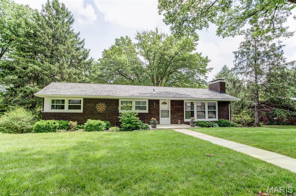 Welcome home to this beautifully updated 3-bedroom, 2-bath home that truly has it all! Lovingly maintained and thoughtfully renovated, this move-in ready property offers an incredible list of updates throughout. Upon entry, you are greeted by a stylish and inviting space featuring luxury vinyl plank flooring carried throughout the home, recessed and updated lighting, fresh paint, updated trim, newer windows, and an all-new kitchen complete with soft-close cabinetry, quartz countertops, and stainless-steel appliances. The layout offers comfortable and functional living spaces with flexibility for a variety of furniture arrangements to fit your lifestyle, creating a warm and welcoming feel throughout.

Major improvements provide peace of mind, including new in 2023: windows, flooring, paint and trim, front and back concrete, some fencing, and garage door openers. Additional updates include a new roof and new electrical panel in 2022, remodeled bathroom, new AC compressor and air handler, along with the beautifully updated kitchen.

Step outside from the lower-level walkout onto a spacious covered patio featuring a brand-new hot tub that will stay with the home — the perfect spot to relax and unwind while overlooking the beautiful backyard. Enjoy views of the large, beautifully landscaped and fenced yard filled with mature trees and plenty of green space. A two-car attached garage and updated exterior spaces complete this impressive property.