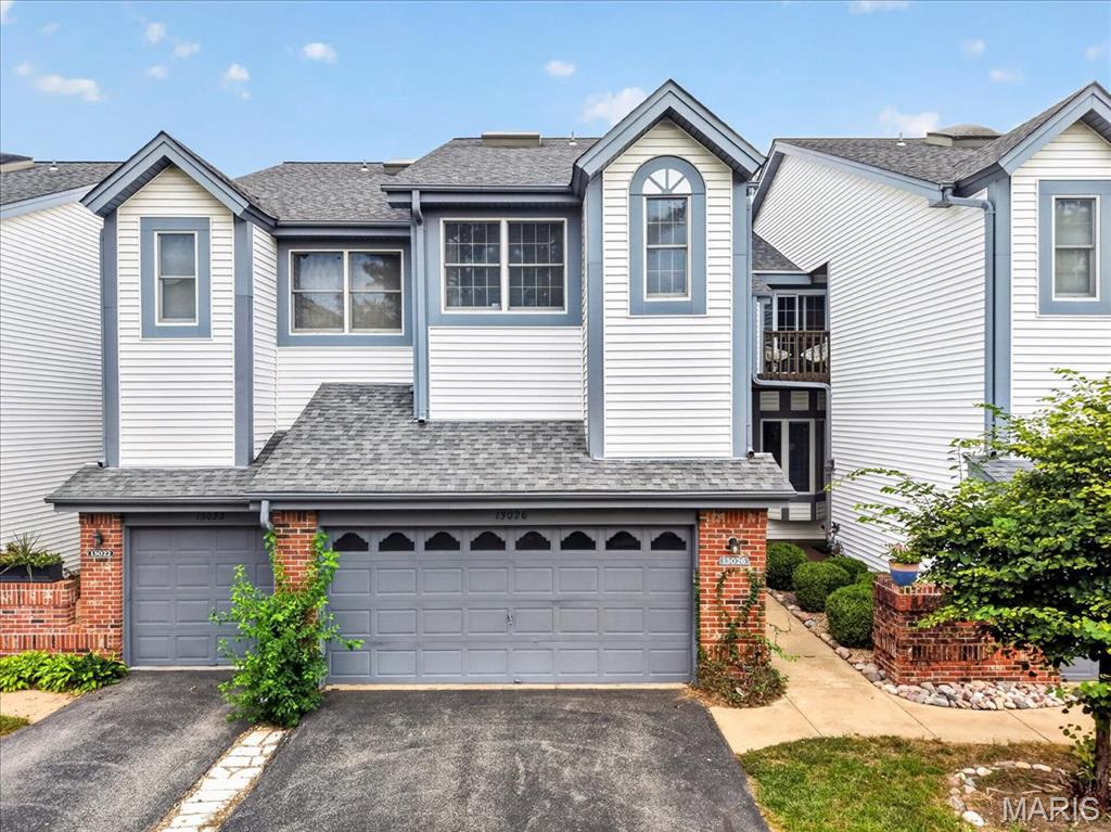Spacious, stylish and surprisingly private, this 2-bedroom, 2.5-bath Field Pointe townhouse offers 1,881 square feet plus a finished lower level and attached 2-car garage. The standout kitchen features crisp white cabinetry, granite counters, a large center island and plenty of room for casual dining. Hardwood floors continue into the inviting living room with fireplace, built-ins and access to a private deck overlooking mature landscaping. Upstairs, the oversized master bedroom features a bay window and generous proportions. The finished walkout lower level adds terrific additional living and entertaining space with a second fireplace, wet bar and full-size windows, then steps directly outside to a secluded patio. Two fireplaces, multiple outdoor spaces and community amenities including hiking trails, a pool and tennis courts make this an easy, low-maintenance place to call home.