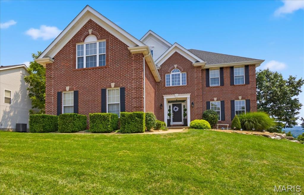 Meticulously updated home in the Legends Golf Community with views of the Meramec River Valley! Curb appeal is A+ with full brick front exterior, side entry 3-car garage, architectural shingles & low maint. landscaping. Walk into a 2-sty entry foyer w/gleaming wood floors, neutral colors, natural light & over 4400 square feet of useable living space. Formal living room opens to a formal dining room with tray ceiling & bay window extension. Great room provides an impressive setting with soaring ceilings, fireplace w/stone accent wall & massive Palladian windows overlooking gorgeous year-round views. Gourmet, eat-in kitchen is improved w/large center island w/gas cooktop, stone counters, 42 in cabinets, custom backsplash, SS appliances, planning desk & breakfast room. Main floor laundry & half bath. Upstairs is a luxury MB suite w/wood floors, crown molding, walk-in closet & spacious master bath. 3 add. BR's on the 2nd level share a 2nd full bath. Walk-out lower level has been fully finished w/rec room, family room, recessed lighting, 3rd full bath, storage space & more. Out back is a large wooden deck off the main level, covered deck below, paver patio with hot tub & fully fenced in yard that the current owners extended with a retaining wall.  RSD, walking distance to the country club & neighborhood amenities.