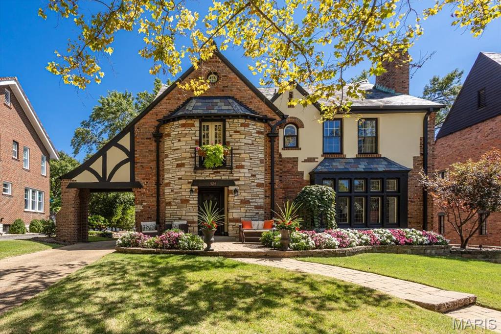 Located in the highly sought-after University Hills subdivision, this stunning home seamlessly blends timeless charm, sophisticated details, and modern upgrades—making it an absolute must-see.  Step through the front door into an inviting foyer that opens to a sun-drenched living room featuring beautiful stained-glass windows and classic built-ins. The expansive dining room is perfectly positioned between the living room, sunroom, and chef’s kitchen—creating an ideal flow for both everyday living and effortless entertaining. The thoughtfully designed kitchen is truly a chef’s delight, offering generous workspace and functionality. Just off the kitchen, a utility room provides a convenient laundry area and full bath, while a stylish half bath is tucked off the foyer. Upstairs, the second level boasts an expansive primary suite complete with a large walk-in closet and private ensuite bath plus two additional generously sized bedrooms and a full hall bath.  A versatile bonus room and charming sunroom offer the perfect space for a home office, playroom, or creative studio. The third floor adds even more flexibility with a fourth bedroom, an additional full bath, and excellent closet space.  The lower level presents endless possibilities—ready to be customized to suit your needs. Step outside from the main-floor sunroom onto a patio overlooking a spacious rear yard—ideal for relaxing or entertaining. An oversized one-car garage, widened driveway for extra parking, and a storage shed complete the property. All of this in an unbeatable location—just minutes from Taco Buddha, Downtown Clayton, Washington University in St. Louis, parks, and schools.