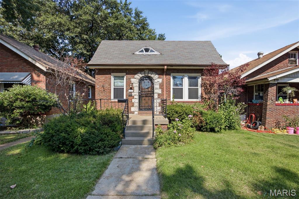 Welcome to 5223 Dewey, a classic brick bungalow in Holly Hills where timeless South City character meets the lifestyle that makes this neighborhood so special. Step inside to find beautiful hardwood floors, abundant natural light, and the warmth and charm you hope to find in a city home. The main level offers two bedrooms and a full bath, while the bonus space upstairs provides added flexibility for a home office, dressing room, creative space, or additional storage. A full walk-out basement offers plenty of room for laundry, storage, hobbies, and more. Out back, the raised porch off the kitchen is ready for morning coffee, summer grilling, or winding down after a day in the city. Beyond the front door, enjoy the best of South City living with Carondelet Park nearby, neighborhood restaurants and local favorites close at hand, and tree-lined streets that make it easy to get out and explore. Whether it's a walk through the park, grabbing a drink nearby, or spending an evening on your own front porch, 5223 Dewey offers more than a place to live—it offers the South City lifestyle you've been looking for.