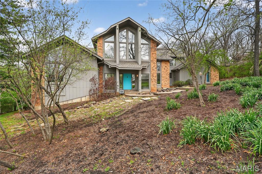 This contemporary Town & Country 1.5-story home offers a rare blend of architectural details and privacy. Set on a secluded 1+ acre cul-de-sac lot backing to mature woods, the property features a private backyard complete with an inground pool, expansive deck, and multiple outdoor living areas—ideal for both entertaining and everyday enjoyment.
Inside, the open floor plan is highlighted by high vaulted ceilings, an open upstairs walkway, and walls of windows that flood the home with natural light. The main level showcases a spacious great room with a fireplace and direct access to the deck overlooking the pool. The large kitchen features a center island, generous pantry, and adjoining breakfast area with access to a sun porch. A formal dining room; open and airy foyer, large utility room, and two conveniently located half baths—one with direct backyard and pool access—round out the first floor. The primary suite is also located on the main level, offering a large bath and an adjacent library that was formerly a bedroom, providing flexibility for today’s lifestyle.
The second floor includes two oversized bedrooms, each with its own large walk-in closet, and a full bath accessible from one of the bedrooms as well as the hallway. A cozy reading nook overlooks the main living space, adding to the home’s unique architectural appeal. The finished walk-out lower level expands the living space further with a family room featuring a stone fireplace, wet bar area, patio access, an additional bedroom, a full bath, and a large office that could easily serve as an additional sleeping area.
Additional highlights include a three-car garage, exceptional storage throughout, and a highly desirable location served by Mason Ridge Elementary School. With its private setting, dramatic interior spaces, and thoughtfully designed layout, this home is a standout offering in contemporary living.

Showings start 4/17
Exterior photos expected Monday 4/20