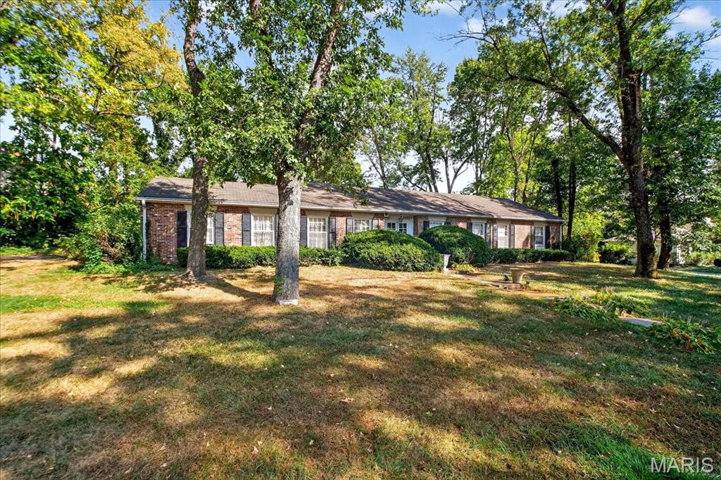 Discover the Hidden Secret of Hampton Park! Welcome to this meticulously maintained ranch-style home, perfectly situated on a full acre of prime, sq-shaped land in one of the area’s most sought-after neighborhoods. Rarely does a property like this come to market, offering charm, modern updates, and potential for expansion. Formerly home to a rose garden, this 3-bed, 2-bath residence combines old-world elegance with stylish upgrades. Step into a gracious foyer that opens to a formal dining room and inviting living room. Hardwood floors flow throughout, including the family room, which features a stunning antique bird’s eye maple mantle over a dbl-sided fireplace. The gourmet kitchen is equipped with high-end stainless steel appliances, granite countertops, breakfast bar, and direct access to expansive enclosed sunroom offering 500+ bonus sq ft of light-filled living space. The divided bedroom layout includes a hall bath and a Jack-and-Jill bath, offering flexibility for guests, home office, or multi-generational living. The full unfinished lower level includes a storage room, sump pump, and washer/dryer hookups, ready for your vision. With nearly 3,000 total sq ft, this home is move-in ready while offering endless opportunity to create your dream estate. Whether you're looking to renovate, expand, or simply enjoy the space as-is, this rare Hampton Park treasure is your blank canvas. Don’t miss your chance to put your stamp on one of the neighborhood’s best-kept secrets.