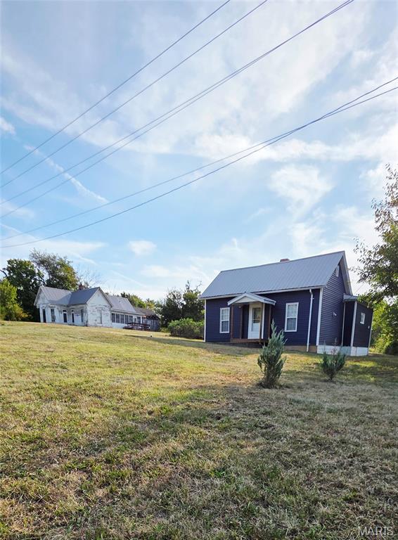 2 Houses and Endless Possibilities on 1.9 Acres in Town!
Rare opportunities like this don't come along often! Situated on 1.9 acres within the city limits, this unique property offers the convenience of all city utilities while enjoying the peaceful feel of being on the edge of town.
The property features a beautifully rehabbed, move-in ready one-bedroom, one-bath home that is completely turnkey—perfect for living in immediately. Also on the property is a second home, dating back to the early 1900s, ready for someone with vision to restore it to its former charm.
Whether you're looking for a multi-generational property, an investment opportunity, or room to grow, the possibilities are endless. Live comfortably in the renovated home while restoring the historic house, then use it as a guest home, rental property, or additional living space. With nearly two acres, there's also plenty of room for family and friends to bring campers and enjoy gatherings together.  Minutes from the Mark Twain Lake and less than 5 miles to the nearest boat ramp. 
If you've been searching for a property with character, flexibility, and incredible potential, this one is a must-see!