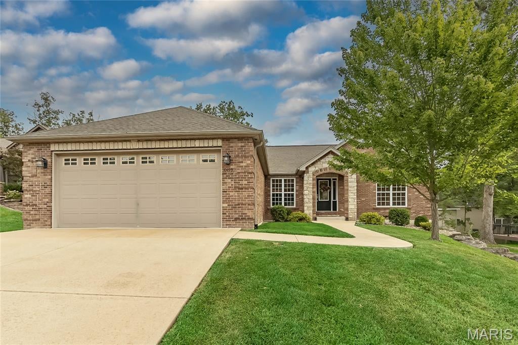 Welcome home to this 4-bedroom, 3-bath ranch in desirable Incline Village, offering resort-style amenities including a lake, beach, pool, golf, courts, walking trails & more! Brick & stone elevation with arched covered front porch welcomes you inside to a split-bedroom floor plan with vaulted ceilings, plant shelves, hardwood floors, built-in bookcase & stone wood-burning fireplace. Private office features glass-paneled French doors. The primary suite offers a luxury bath w/separate shower, jetted tub, double vanity & organized walk-in closet. Oversized finished 28-ft-deep garage offers room for a boat, plus a detached golf cart garage! Composite deck overlooks the yard. Partially finished walkout LL features a media room, 4th bedroom, full bath, laminate flooring, slider & loads of windows for natural light, plus plenty of unfinished storage. Enjoy space, functionality & the Incline Village lifestyle!