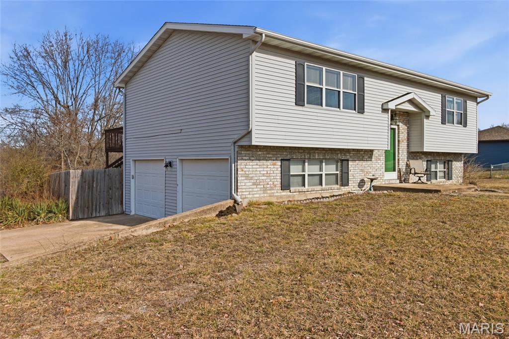 NEW UPDATES to the primary bedroom and back deck! Close to the South Gate of Fort Leonard Wood and I-44, this spacious split level home offers a comfortably large master suite, eat-in kitchen and large living room with two extra bedrooms, a privacy fenced-in back yard, and a large corner lot. BRAND NEW ROOF in 2025! With a great location and all the space and comfort you could ask for, come see what this home has to offer you!