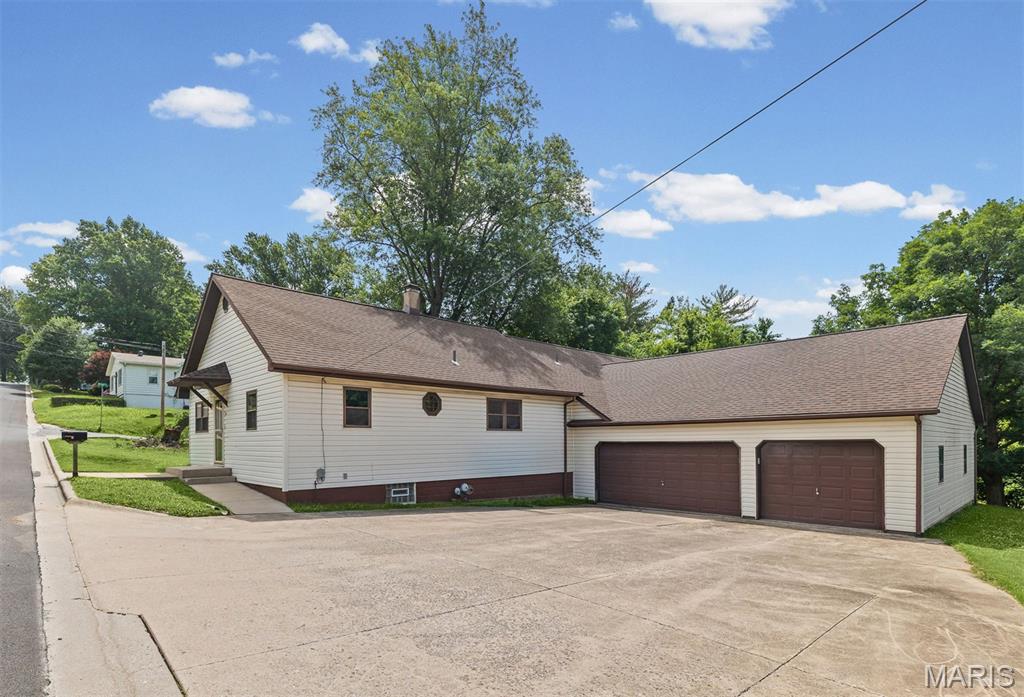 Spacious Ranch with a Finished Walkout Lower Level, Second Kitchen, Oversized Garage + Workshop, all on an almost half-acre lot in downtown Glen Carbon – Incredible Value at $225,000!

Welcome home to this spacious ranch offering exceptional square footage, versatility, and an unbeatable location just a short walk from Miner Park and the local library. Opportunities like this are hard to find at this price point.

The main level features 3 bedrooms, including a spacious primary suite with a walk-in closet and private bath with a double vanity. You'll love the open living areas, convenient main-floor laundry, and large kitchen complete with a center island, gas cooktop, and built-in oven. The two additional main-floor bedrooms share a Jack-and-Jill bath, and a convenient half bath is also located on the main level.

The finished walkout lower level expands your living space with a second full kitchen, large family room with a gas fireplace, 3/4 bath, and endless possibilities for entertaining, multi-generational living, guest space, or potential rental income.

Outside, you'll find an oversized 3-car garage plus an adjacent workshop area with its own overhead door—perfect for hobbies, storage, projects, or additional workspace.

Recent updates include a new roof (2025), furnace (2025) some new carpet (2025), one new water heater (2025), and an A/C system approximately 10 years old. All kitchen appliances, as well as the washer and dryer, are included with the sale.

This home does need some TLC and is priced accordingly. Several windows are broken, flooring and bathroom updates are needed, and the deck will likely require replacement. However, at just $225,000, this property presents an incredible opportunity to build equity in a highly desirable location.

Whether you're a buyer looking to customize a home to your taste, an investor searching for your next flip, or a landlord seeking a strong rental property, the potential here is undeniable. With its generous square footage, large lot, flexible floor plan, major recent updates, and prime location near Miner Park and the library, this is a rare opportunity to create something special at an affordable price.