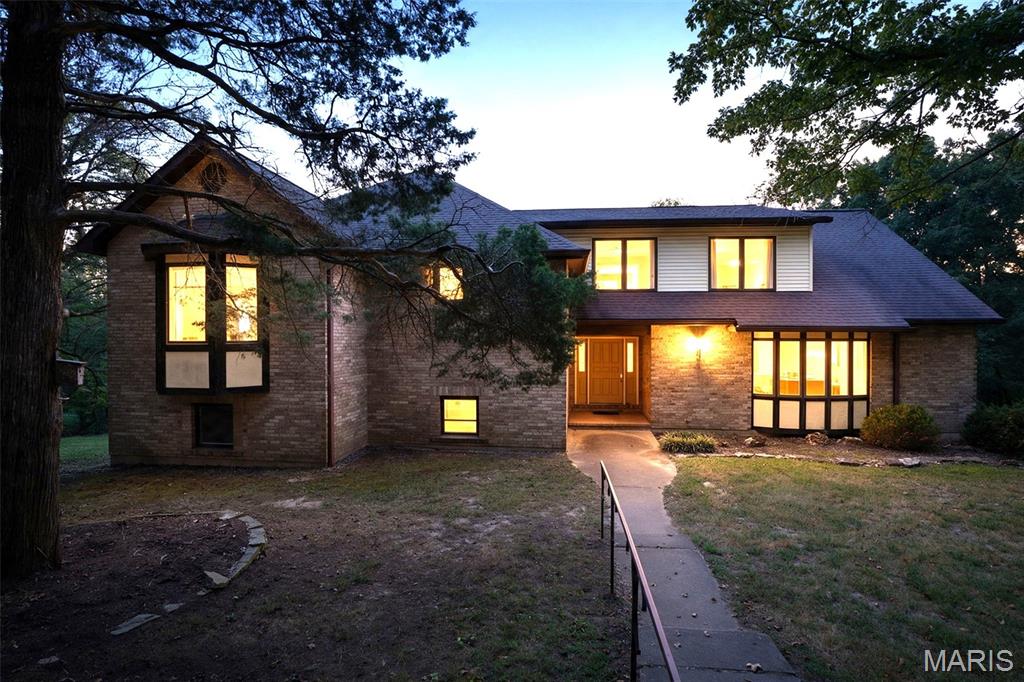 Welcome Home!!   Country Living at its finest!!!   At just over 4000 sq ft, and 3.5 acres (more acreage available), you will enjoy all rural living has to offer...   This mostly-brick multi-level home is absolutely loaded with features you won't want to miss.    From its circle driveway, to the spectacular views overlooking the river valley, the possibilites are endless.   This wonderful home, built to last, includes upgrades such as a 42" front entry door, a dedicated generator bypass electrical panel with exterior generator hookup plug, Zoned HVAC with 3 full units, dual water heaters, oversized garage with workshop area and side service door to the back yard, fresh flooring and paint updates, huge bedrooms, casement windows, and new appliances (stove, microwave & dishwasher).    This unique multi-level floor plan has 4 levels of finished living space, and still a large basement for storage.    As you enter thru the front door, you will be on the main living area with great room, kitchen, breakfast room, dining room, large den (could possibly be a sleeping room) and full bathroom.  This level includes 2 door out to the deck in the back overlooking the river valley.   You can go down a half level to a game room, rec room and laundry room.    Then down another half-level to the basement and garage area.    If you go up a half-level from the main floor, you will find 2 large bedrooms, and a full bath with separate tub and shower.   Up a half-level from there, you will find the gigantic primary bedroom with its own extra room (could be a craft room, nursery, sewing room, reading room, TV room, your call) as well as a walk-in closet, and large bathroom double vanity, as well as a separate shower and jetted tub.    This home is in the process of getting a new roof (similar color) and new siding.   Seller is offering a credit for replacing the older deck, or may actually be replaced soon, pending contractor availability.     Hurry over to view this amazing opportunity.     Additional acreage is available next door (as a separate 3.6 acre lot) for 35K.