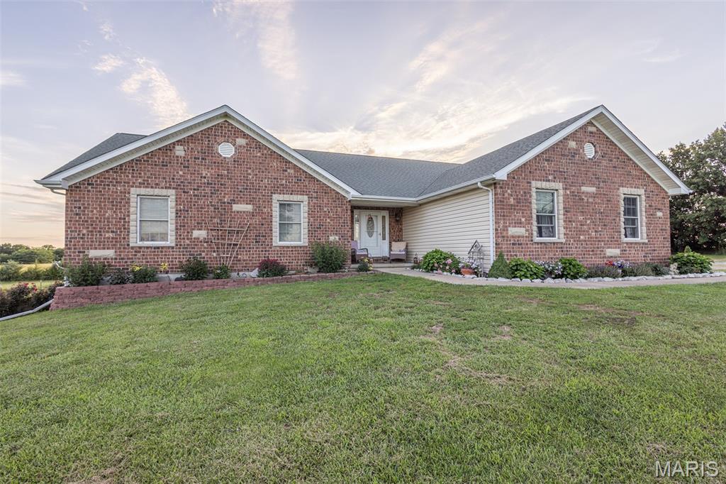 Welcome to country living at its finest! Situated on 5± acres in Monroe County, Missouri, this beautiful 4-bedroom, 3-bath home offers the perfect blend of rural privacy, modern comfort, and convenient access with blacktop road frontage.

The home features a spacious, functional floor plan with ample room for family living and entertaining. A full walkout basement provides additional living space, storage, and endless possibilities for recreation, a home office, or future finishing options. Large windows throughout the home showcase scenic views of the surrounding countryside, while the well-maintained yard creates an inviting setting for outdoor enjoyment.

A standout feature of the property is the detached shop, which provides ample space for equipment storage, vehicles, hobbies, or a workshop. The acreage offers plenty of room for gardening, outdoor recreation, livestock projects, or simply enjoying the peace and quiet of country life.

Whether you're looking for a permanent residence, a place to raise a family, or a rural retreat with room to spread out, this property offers space, setting, and improvements that are becoming increasingly difficult to find. Enjoy the best of country living with the convenience of blacktop access and all the benefits of owning your own piece of Monroe County.