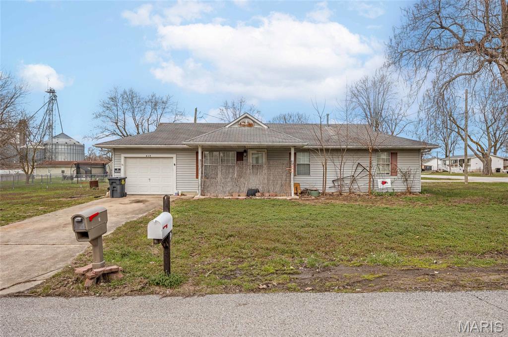 Welcome home to this lovely 3 bedroom, 2 bathroom ranch house in the heart of small town living. Step inside to find a welcoming open floorplan with the living space flowing seamlessly into the kitchen and dinning area. A large primary suite offers a large closet and it's own bathroom. Across the hall are two more bedrooms, each with generously sized closets for ample storage. Step into the garage to find extra space for a work bench or additional storage. The corner lot offers plenty of space for entertaining, kids to play, dogs to run, or just to enjoy the peace and quiet of small town life.  This home is within walking distance of school, the city park, bank, gas stations, and convenience stores. This home is a 3 party transaction and is being sold as is so please bring special sale contracts only. Schedule your showing today!