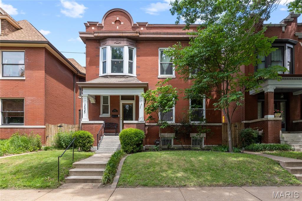Located near Tower Grove Park and the vibrant South Grand district, this beautifully updated brick home offers the charm, walkability, and character buyers love about South City living. A gracious entry hallway welcomes you into an open main level designed for entertaining, featuring a spacious living room filled with natural light and an oversized dining room accented by an ornately tiled decorative fireplace, the very space where the current owners hosted their intimate wedding celebration. The updated kitchen offers ample cabinetry, stainless steel appliances, and direct access to the first of two decks overlooking the backyard retreat. Upstairs, you’ll find three bedrooms, two full baths, and access to the second deck. The spacious primary bedroom features hardwood flooring, oversized windows, a cedar-lined closet, and beautiful crown molding details that add to the home’s historic charm. The partially finished lower level includes an additional half bath, flexible living space, and abundant storage. The current owners especially love the stained glass windows, the natural light throughout the home, relaxing in the backyard, and being just a short walk from Tower Grove Park, South Grand restaurants, Jay International, and neighborhood favorites like Rooster, The Vine, Pho Long, Pizza Head, Basil India, and Cafe Natasha. Whether it’s Food Truck Friday, the Saturday Farmers Market, or an evening stroll through the park, this location truly delivers the best of city living.