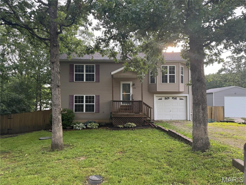 Welcome to Lake St Clair living in beautiful Franklin county, MO! Situated on a .219 acre lot, this split-foyer home offers a functional layout with plenty of space to spread out. The upper level features a bright, updated kitchen with some newer appliances, separate dining, comfortable living room, and a bedroom, creating a cozy main living area. Master bedroom has walk in closet and in bath there is a stackable washer and dryer. The lower lever adds even more versatility with 2 additional bedrooms, a full bath, and utility. This property offers a great combination of comfort, practicality and location in desirable Lake St Clair with its 4 lakes for swimming, boating, fishing, or water acitivities. Minutes from I-44, local shopping and schools.