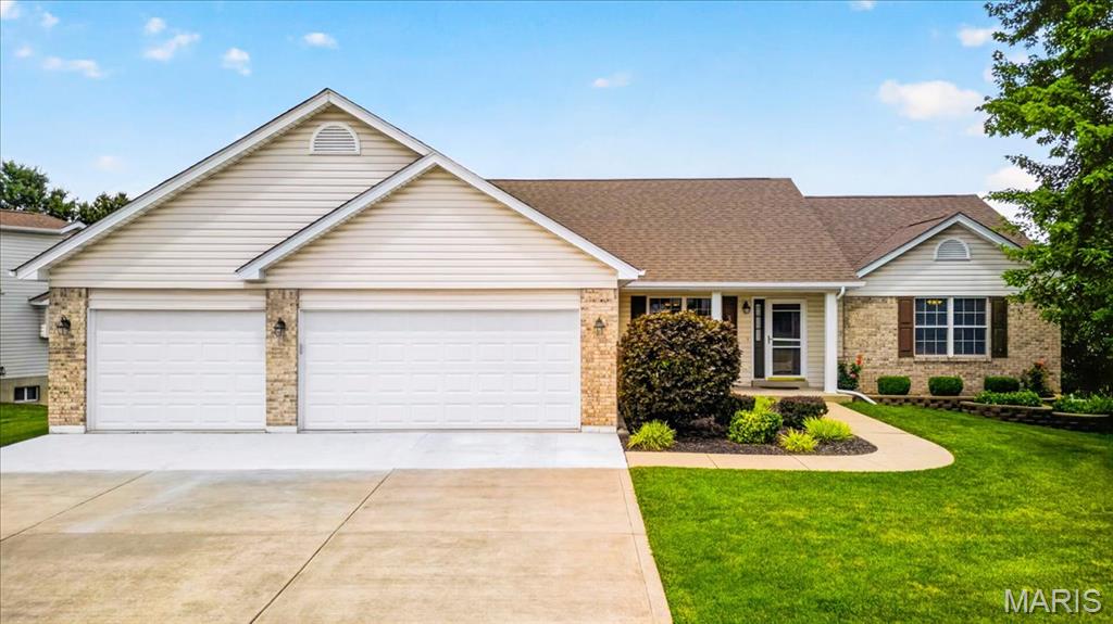 Welcome home to this beautifully maintained ranch offering the perfect blend of comfort, space, and functionality! Step inside to an inviting open floor plan with soaring vaulted ceilings and oak hardwood flooring throughout most of the main level. The spacious living area flows seamlessly into the kitchen, featuring granite countertops, newer appliances, and plenty of cabinet space for everyday living and entertaining. The main level offers three generously sized bedrooms and two full bathrooms, including a comfortable primary suite. Downstairs, the finished walk-out lower level expands your living space with a large recreation area, a wet bar, a third full bathroom, abundant storage, and end eless possibilities for entertaining, hobbies, or guests. Outside, enjoy relaxing mornings on the covered front porch or unwind on the deck featuring new spindles while overlooking the corner lot. Additional highlights include a desirable oversized 3-car garage, irrigation system, sump pump, architectural shingle roof, and thoughtful updates throughout.

Conveniently located in O'Fallon with easy access to shopping, dining, parks, and major highways, this move-in ready home offers the space and features today's buyers are looking for!