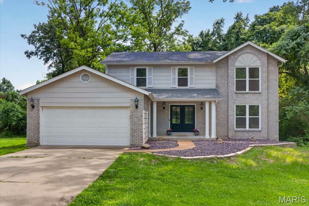 Completely transformed from top to bottom, this exceptional four-bedroom home offers the perfect combination of timeless design, thoughtful functionality, and today's most sought-after finishes. Every surface has been meticulously renovated, creating a truly move-in ready home where no detail has been overlooked.

Designed for both everyday living and entertaining, the main level offers an inviting open floor plan. A stunning dining room highlighted by a statement chandelier flows seamlessly into a versatile front living space, ideal as a formal living room, home office, or sitting room. At the heart of the home, the spectacular kitchen showcases custom cabinetry, gorgeous stone countertops, brand-new stainless steel appliances, and an oversized sink perfectly positioned to overlook the expansive backyard. The adjoining breakfast room features sliding doors leading to an impressive new deck, creating effortless indoor-outdoor living. Open to the kitchen, the spacious family room is anchored by a beautiful brick fireplace with built-ins, providing a warm and welcoming gathering space.

Practicality meets style with the newly expanded mudroom/laundry room offering extensive built-in storage, a convenient bench, and direct access to the attached two-car garage.

The spacious primary suite is a private retreat, featuring a generous walk-in closet and a spa-inspired bath with designer tile, luxurious finishes, and a calming, sophisticated aesthetic. Three additional generously sized bedrooms share an oversized, beautifully updated hall bath.

The partially finished lower level adds valuable living space with daylight windows, a half bath, and endless possibilities for recreation, fitness, or future expansion.

Extensive improvements include a new roof, new windows, new flooring throughout, all-new lighting, a new deck, updated mechanicals, and beautifully renovated interiors—every inch of this home has been thoughtfully reimagined.

Situated on an expansive, nearly half-acre, fully fenced lot overlooking a picturesque park, the setting is just as impressive as the home itself. Residents will enjoy neighborhood walking trails, a nearby playground, and the convenience of the highly regarded Parkway North School District. This is a rare opportunity to own a truly turnkey home where exceptional updates, an outstanding location, and modern living come together beautifully.