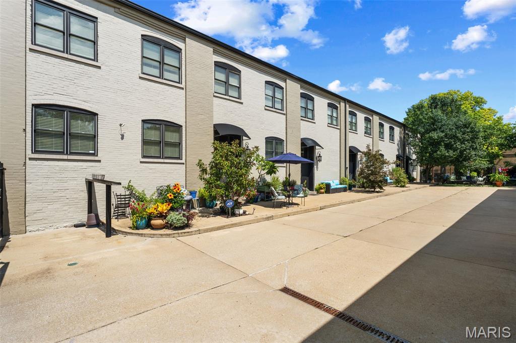 One-of-a-kind investment opportunity! Own an entire 5-unit boutique townhome complex totaling nearly 12,000 SF in a historic former horse stable/carriage house serving the nearby Compton Heights mansions. Redeveloped in 2014 using state and federal historic tax credits, the property blends irreplaceable historic character—including original beams and soaring ceilings—with modern construction, systems, kitchens, baths, wood floors, windows, appliances and fixtures.
Each of the five townhomes offers a unique floor plan and personality, ranging from 2,098 to 2,748 SF, with 2-3 bedrooms, 2.5 baths, and dramatic loft-like living spaces. Two end units offer an abundance of windows, while several units feature open lofts, dens and/or clerestory windows. Unit E is the largest and most traditionally finished, offering 2,748 SF, 3 large bedrooms, 2.5 baths and granite countertops.
Significant income upside! Two units are currently being used by the owner. The remaining units include one long-term rental, one short-term rental and one recently vacated unit, providing immediate flexibility and the opportunity for an investor to implement and optimize their preferred rental strategy. Recently created condominium documents for the Compton Heights Stables Condominium Association further expand the potential ownership and future disposition strategies available to an investor.
Gated entry, 10 covered parking spaces (2 per unit), great common space and a private interior setting with all units facing the parking/common area rather than the street. Extensive solar panels on both the roof and carport add to the property's environmentally conscious approach. An exceptionally rare opportunity to acquire a distinctive, income-producing asset with historic character, modern amenities, flexibility and tremendous potential to increase returns. 
Situated a few blocks from Tower Grove Park and the Botanical Gardens, and conveniently located within walking distance to many of the Tower Grove, Shaw, Fox Park and South Grand restaurants & shops.