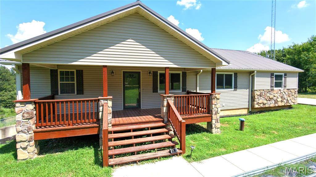 For Sale - 404 County Road 309, Alton, MO 65606.

Escape to the beauty of the Missouri Ozarks with this spacious 5-bedroom, 3-bathroom ranch home on 11.5 private acres in scenic Oregon County. Built in 2015, this home offers an open-concept floor plan with over 3,000 square feet of living space, beautiful panoramic views, and the perfect blend of comfort, privacy, and outdoor recreation.

The main level features a bright living, dining, and kitchen area with a center island, stainless steel appliances, pantry, and access to the rear deck. The primary suite includes a double vanity, walk-in shower, and soaking tub. Two additional bedrooms and a full bath complete the main floor.

The finished walkout lower-level offers a large family room, two additional bedrooms, a full bath, and new carpet and luxury vinyl flooring installed in 2026.

Energy-efficient upgrades include a 10.125 kW Tesla solar array with two new Tesla Powerwall 3 battery backup systems, along with a completely updated septic system in 2026. Additional features include a metal roof, two-car attached garage, central heat and air, high-speed internet availability, fenced backyard, gardening area, wooded acreage, and open fields.

Located just minutes from the Eleven Point National Scenic River, this property is an outdoor enthusiast's dream with outstanding opportunities for floating, fishing, hiking, hunting, and exploring the Ozarks.

If you're looking for a move-in-ready country home with modern amenities, energy efficiency, and plenty of room to enjoy the outdoors, this exceptional property is one you won't want to miss.