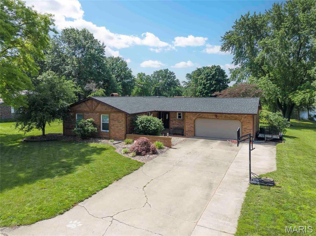Spacious and beautifully maintained 4-bedroom, 3-bath brick ranch offering comfortable living and exceptional entertaining space. The inviting living room features a cozy fireplace and flows into a fully finished sunroom with beautiful views of the spacious backyard and adjacent green space. The large eat-in kitchen is designed for both everyday living and entertaining, featuring a center island, modern appliances, abundant counter space, and ample cabinetry for storage. The primary suite offers a generous closet and private full bath, while the additional bedrooms are generously sized with excellent closet space. The recently finished lower level expands the living area with a large recreation room complete with a full bar and open layout ideal for gatherings. A fourth (non conforming) bedroom and full bathroom on the lower level provide privacy and flexibility for guests, a home office, or multi-generational living. The basement also includes extensive dry storage space. A spacious 2-car attached garage provides room for larger vehicles along with additional workspace and storage. Outdoors, relax on the private patio overlooking the backyard and tranquil pond views, creating a peaceful setting to enjoy nature and the surrounding landscape.
This home combines spacious interiors, thoughtful updates, and a desirable setting, making it an excellent opportunity for comfortable family living and entertaining.