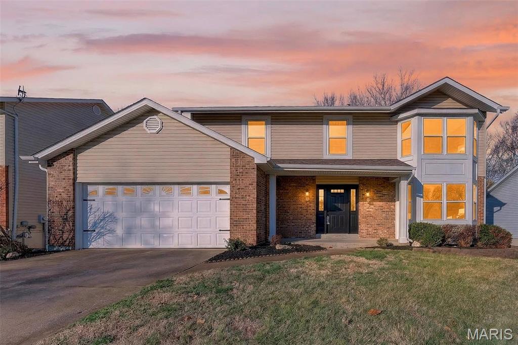 Beautifully updated 2 story home offering over 2100 square feet of living space in the sought after Fort Zumwalt School District. This 4 bedroom, 2.5 bath home features professional landscaping and a freshly painted interior with stylish LVP flooring throughout much of the main level. The living room welcomes you with a bay window and flows into the dining room with elegant wainscoting and updated lighting. The kitchen offers 42 inch white cabinets, granite countertops, stainless steel appliances, breakfast bar and convenient main floor laundry. The breakfast room opens to a screened in porch with stairs leading to the level fenced backyard that backs to trees and a walking path. The family room includes a bay window, ceiling fan and cozy gas fireplace with built in bookshelves. Upstairs the primary suite features a walk in closet and private bath with double vanities, soaking tub and separate shower. Bedrooms 2, 3 and 4 offer LVP flooring, ceiling fans and built in closet systems. The hall bath features an updated vanity, lighting, LVP flooring, skylight and shower/ tub combo. The unfinished walk out lower level opens to a concrete patio and fenced backyard.