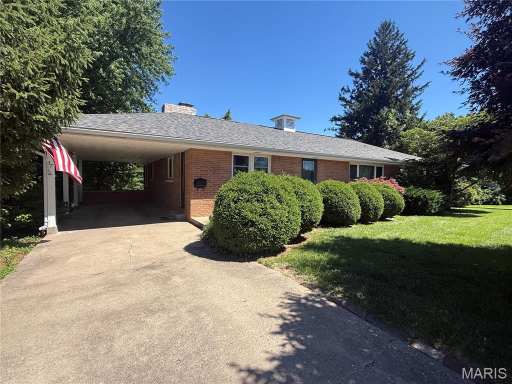 Brick, ranch home located in established neighborhood near schools and shopping. The home has a new roof and central air unit within the last month. The main level offers a family room , living room, combination dining room and kitchen, sun room, three (possibly four) bedrooms, one full bathroom, and one half bathroom. The sun room off of the kitchen overlooks the private, parklike backyard. The family room has a gas fireplace and built-in bookcases. The basement has a half bathroom, unfinished room, storage room, and laundry room. There is a carport for off street parking. Storage room with exterior access off the back of the house.