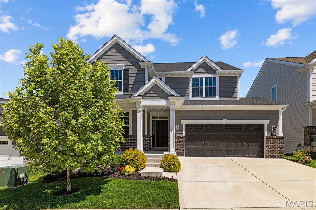 Welcome to this beautiful 2-story in the heart of Wildwood! Built in 2021, you'll have the peace of mind of newer construction in a wonderful community. Walk or bike to Wildwood Town Center, Wildwood Community Park, Wildwood Square, West Ridge Center, Good News Brewing and the new Village Green's park, playground and amphitheater. You'll have great curb appeal with landscaping, brick accents, James Hardie Plank siding, and a large covered porch leading you inside. The foyer opens to the enclosed office/flex room and open layout of the main living space that's perfect for hosting gatherings or everyday family living. You'll love the abundance of natural light and waterproof, durable luxury vinyl plank flooring throughout. The dining room features a tray ceiling and is open to the living room and kitchen. You'll love the large center island w/breakfast bar, granite counters, black stainless steel appliances, 42" cabinets, black fixtures, and stylish Kichler light fixtures. Off the kitchen is the breakfast room and spacious living room with a cozy gas fireplace. 9-foot ceilings, transoms above the exterior doors, and plenty of windows give a bright, airy feel to the space. A half bath w/pedestal sink, mud room, and laundry w/utility sink completes the main level. Upstairs is an open-air loft, three bedrooms, two full bathrooms, plus a beautiful primary suite with a tray ceiling, walk-in closet, and showstopper bathroom featuring two separate vanities with granite counters, and an upgraded luxury tile-surround shower with dual shower heads. The walk-out basement has rough-ins for a full bath and a window for a possible bedroom, plus space for a rec room and plenty of storage. With the option to enclose the loft as a 5th bedroom and a finished basement, the home could easily become a 6 bedroom/4.5 bathroom to accommodate your growing family or space needs. Plus a larger 75 gallon water heater can keep up with your expansion, easily providing hot water to all 3 current bathrooms and more. Enjoy sunset views on the deck overlooking the fenced backyard or relax on the covered patio. In a great location moments from Rockwood Schools, I-44, Babler State Park, and Rockwoods Reservation, this home is one you won't want to miss!