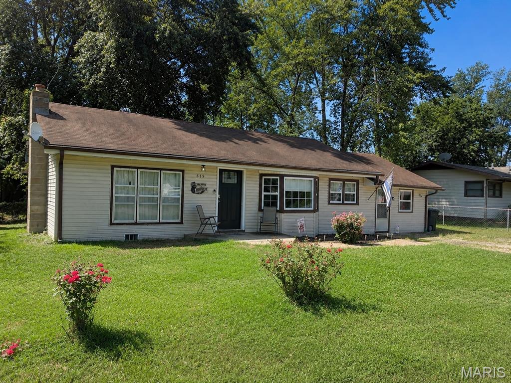 Great location and affordable living!!! This adorable 3 bedroom home is walking distance to the city park. As soon as you walk in you’ll feel right at home in the large living room with laminate flooring and modern open floor-plan. The living room leads right in to the kitchen with its massive island, perfect for entertaining. There are 3 bedrooms and a nice sized utility/laundry room just off the kitchen. There is a nice sized bathroom centrally located to the bedrooms and living areas.  Outback you’ll find a large fenced yard, covered back deck and an outbuilding for extra storage. All of this in a great neighborhood. Don’t miss out. Call to see this home today!