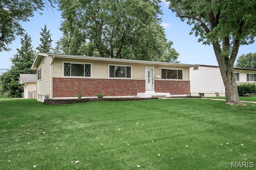 Welcome to this beautifully refreshed 3-bedroom, 1 full bath, 2 half bath home situated on a desirable corner lot and within walking distance of Queen Ann Park! Inside you will find a bright and inviting main level featuring fresh paint, new carpeting throughout the bedrooms, updated light fixtures, and an abundance of natural light. The kitchen offers stainless steel appliances and new vinyl flooring, while the renovated bathrooms provide a fresh, updated feel.
The finished basement offers plenty of additional living and entertaining space, complete with a built-in dry bar and half bath. Outside, enjoy the fenced-in backyard and screened-in patio, perfect for relaxing or entertaining. The large detached 2-car garage provides ample parking and storage space, while the newer HVAC system offers added peace of mind. With numerous updates, flexible living space, and a central location, this home is ready for its next owner!