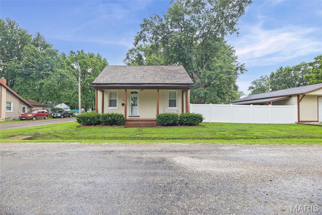 Step into the timeless charm of this **beautifully updated 1893 home** where historic character meets modern-day comfort. From the moment you enter, you'll appreciate the **high ceilings**, spacious rooms, and the craftsmanship that gives this home its warm, inviting feel. Offering **2 bedrooms plus a large tandem third bedroom**, the flexible floor plan is perfect for a third sleeping area, nursery, home office, playroom, or guest room.

Outside, you'll find a **large backyard enclosed with newer vinyl privacy fencing**, providing plenty of room to entertain, relax, garden, or let kids and pets play. The **detached garage is equipped with 220-volt electrical service, water, a separate workshop, and additional storage**, making it an ideal setup for mechanics, woodworking, hobbies, or DIY projects.

Situated in the desirable community of Millstadt, this home offers the best of both worlds—small-town charm with convenient access to Belleville, Columbia, Scott Air Force Base, MidAmerica St. Louis Airport, and downtown St. Louis. Rich in history, thoughtfully updated, and offering versatile living spaces both inside and out, this one-of-a-kind property is ready to welcome its next owners.