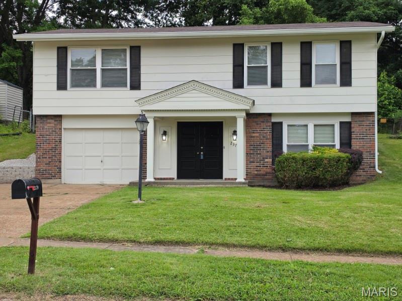 Welcome to 2379 Wesglen Estates Drive, offering two levels of freshly painted living space. The lower level features a newly carpeted Family Room with a large window, half bath, and access to the laundry room and attached garage. The main level includes a bright Living Room with large windows and gleaming hardwood floors, three bedrooms with deep closets and hardwood floors as well. The Primary Bedroom has easy access to the full hall bathroom. The Eat-In Kitchen provides ample counter space, some stainless steel appliances, abundant cabinetry, and sliding doors leading to the covered patio. Enjoy a the new retaining wall, fully backyard fenced, level lot backing to mature trees, perfect for outdoor enjoyment. Located in the Pattonville School District, highly desirable Wesglen Estates neighborhood with a playground. Close to Creve Coeur Lake and Park, Maryland Heights Community Center and Waterpark, schools, shopping, and restaurants. Easy access to highway 270 and the Page Extension.
