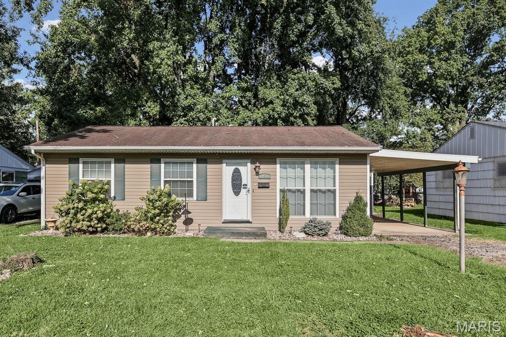 Welcome to this beautifully updated Ranch perfectly located just across the street from Caseyville Elementary! Step inside to discover fresh paint throughout and brand-new carpeting in the bedrooms, creating a bright and inviting feel from the moment you enter. The main level features a spacious living room showcasing beautiful hardwood floors that flow right into the eat-in kitchen. This functional space comes complete with convenient main-floor laundry, updated cabinetry, and newer appliances—including a brand-new refrigerator. Enjoy peace of mind knowing the big-ticket items have already been taken care of, as the home has been heavily modernized with a high-efficiency HVAC, windows, exterior doors, plumbing, and electrical systems. Outside, enjoy the fully fenced backyard complete with a patio space for entertaining, a 12x12 storage shed, and a one-car carport.
Don't miss your opportunity to own this move-in-ready, updated home in a fantastic location! Call your favorite realtor to schedule a private tour!