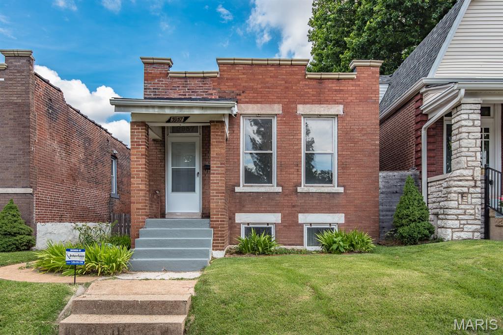 Adorable brick home steps from South Grand, Morganford business district and Tower Grove Park! This cutie is just waiting for your finishing touch! You are greeted with a light and bright living room, decorative brick mantle. Hardwood floors throughout. All appliances stay.  There is no refrigerator!

Laundry and storage in the tidy basement.Newer tear down roof! Fenced private backyard with a garage! Quick walk to breweries, restaurants, shops, grocery, nightlife and wonderful Tower Grove Park
for Food Truck Friday and Farmer's Market. What a fun place to live!