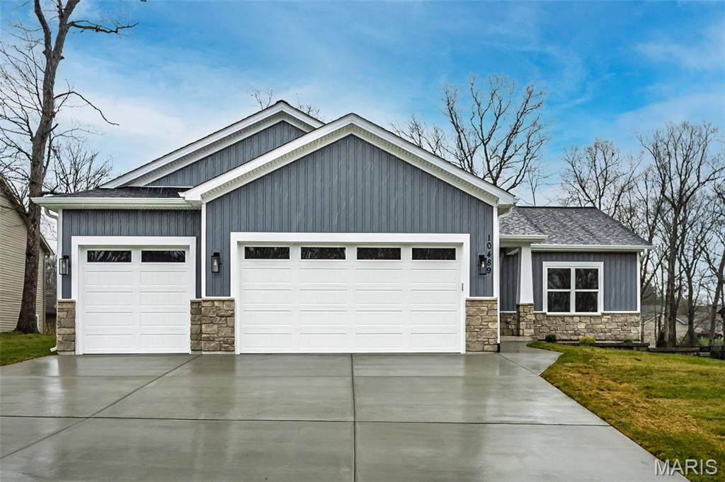 Beautiful New Construction Ranch in a Gated Lake Community w/ Smart Finishes Throughout! This 3 BR, 2 BA home offers the split-BR, open layout today’s buyers are searching for, paired w/ craftsman curb appeal featuring stone, vertical siding, architectural roof, and oversized 3 car garage. Inside, 9 ft ceilings and durable high-grade LVP flooring create a clean, modern feel from the moment you walk in. The kitchen is designed to impress with 42” cabinetry w/ crown, soft-close doors, pullouts, tile backsplash, SS appliances, and gorgeous Quartz counters, all flowing seamlessly into the great room w/ recessed lighting, stylish fireplace, and easy everyday living. The primary suite is a comfortable retreat with custom cabinetry, double vanity, large walk-in Onyx shower, and generous closet space. Step outside to the full maintenance-free 12x21 Trex deck overlooking the gently sloping backyard, giving you a peaceful space to relax, entertain, or simply enjoy the setting. Located in a gated community with lake access, beach, pool, and public golf course, all just minutes from Wentzville Pkwy, this home offers the right mix of comfort, style, and convenience. Schedule your showing today!