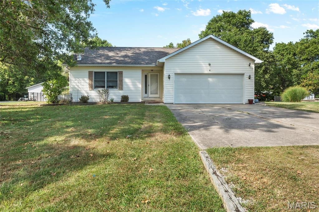 Welcome to this cute, move in ready home located in Triad School district. This home is located in Stonebrook estates, has a 2 car garage and sits on a nice private (back property line), level, good size lot. A utility shed w/ loft area adds to the storage space available in this home. This home hosts 3 bedrooms, 2 full baths and main floor laundry. The living room is open to the dining area. Home does have working, maintained wood burning stove. Make an appt to view this home today!
