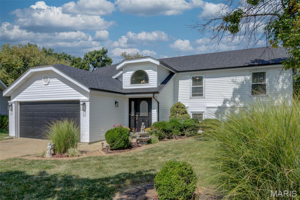 Unique opportunity with SO many updates!!!! This home features a full second kitchen complete with water filtration system, two of the five bedrooms, 3rd full bath and huge family room on the lower level with a walkout to the patio and yard. Perfect for hosting company, accommodating multi-generational living, or a renter. This home has been freshly painted and features crown molding throughout the upper and lower level, new blinds throughout, new window sills throughout, new flat black lever style door handles, new wood burning fireplace insert, new stone veneer, and marble hearth. Three new sets of sliding doors, recessed lighting in lower level, new interior and exterior light fixtures, New deck, including primary bedroom private balcony, new siding, roof, gutters, and downspouts. New flooring, new stairway. Kitchen has new appliances, counters, backsplash. Lower level bathroom updated. Upper level hall bath features working jacuzzi. This home is NOT a flip. It has been owner occupied by the same sweet family for the past 24 years.