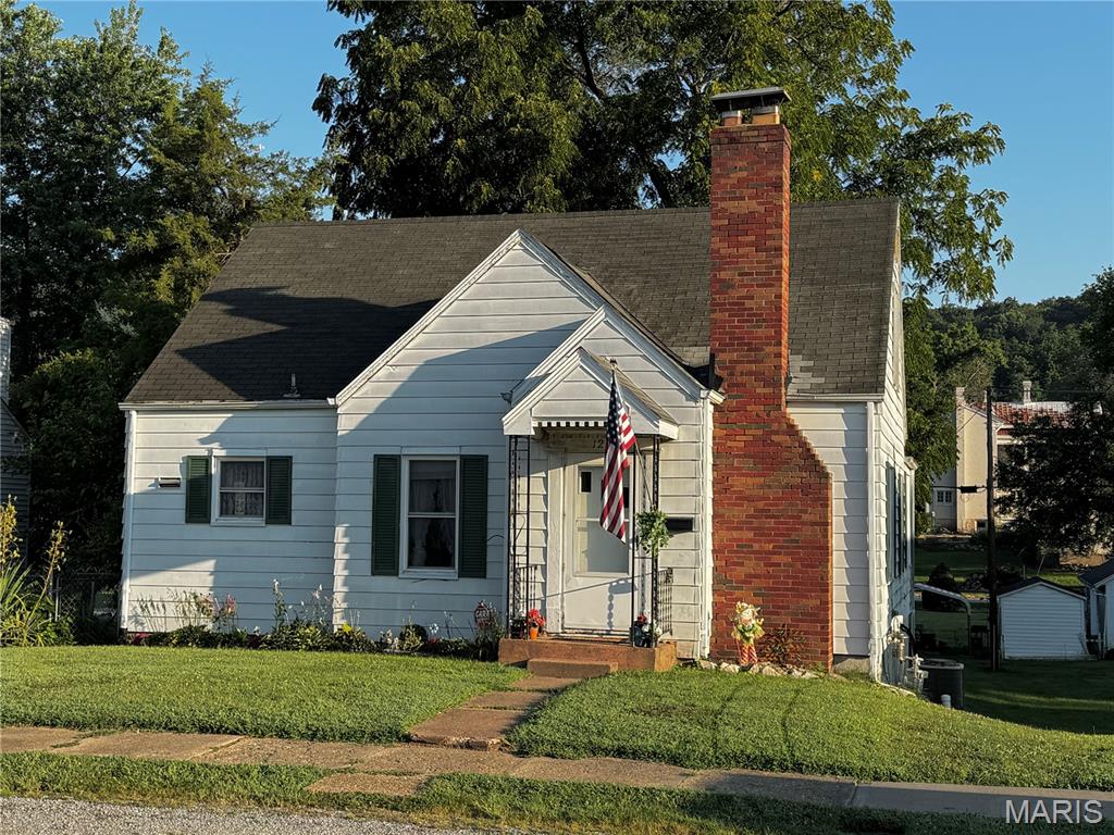 This is the epitome of a cozy cottage - but with room to GROW! One and a half story listed on county records as 900 sq ft. main level, 630 sq. ft (unfinished) upstairs in a fun attic space perfect for another bedroom (or two) or multi-use space. Full unfinished basement has a unique entry that used to be a tuck-under garage accessed from backyard/alley. Make it part garage and part finished living space or leave for storage or workshop. Many options. Curb appeal, small back patio and partially-fenced backyard. Definitely one to consider quickly because it is affordably priced to sell with some potential upgrades and maintenance to address but move-in ready and cute as can be!