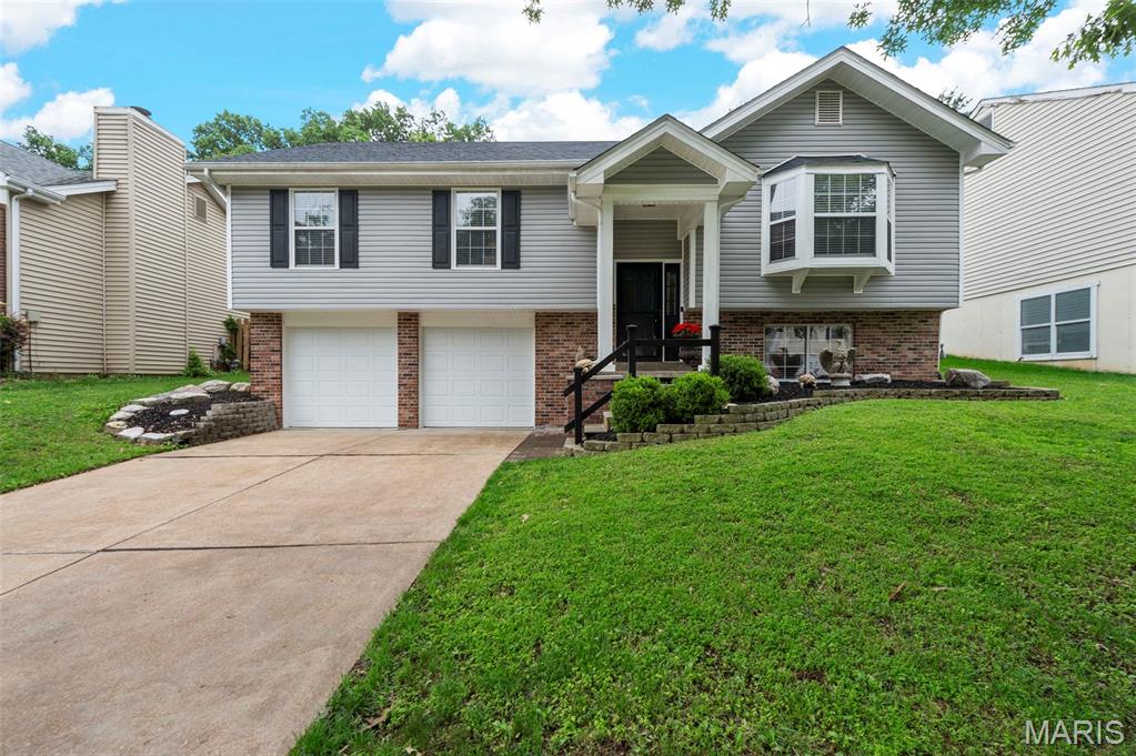 2454 Maple Crossing Drive went through a head-to-toe renovation five years ago and has been well-maintained ever since. Newer roof (2024). Newer furnace. Newer siding. All newer flooring, lighting, updated kitchen and baths. This is not a house that needs anything before you move in.

The upper level is where the home really delivers. The eat-in kitchen is the main attraction, featuring beautiful granite countertops, a stylish tile backsplash, stainless steel appliances, and sliding doors that open directly to the paver patio and fenced backyard. Wood veneer flooring runs throughout the main living areas with ceramic tile in the kitchen and baths. The family room is anchored by a gas fireplace refaced in stacked stone veneer, one of those updates that makes a room feel elevated yet comfortable.

The primary suite stands out. A vaulted ceiling opens the room up in a way that the square footage alone does not capture. The bathroom was fully remodeled and finished to match: dual sinks, a tiled shower with a glass door and surround, and a large picture window that fills it with natural light...the kind of detail that makes the space feel more spa than basic. The hall bath was refreshed to match the same updated standard. Two additional bedrooms and a full bathroom with tub round out the upper floor.

The lower level adds a fourth bedroom, currently set up and used as a second family room. Home office, kids hangout, guest quarters, workout room, creative space. It is a flexible room that adjusts to whatever your life calls for. The two-car attached garage enters at this level as well. The laundry area and additional storage finish out the space. 

Outside, the paver patio off the kitchen sliding doors is a clean, finished outdoor space set within a partially fenced yard with a newer rear retaining wall that keeps the grade level and functional. Morning coffee or a weekend cookout, it works either way.

Additionally, this address sits within the municipality of Wildwood with a Ballwin mailing address, which means the best of both worlds without having to pick one. Wildwood brings nearly 40 miles of paved trails and greenways, Wildwood Community Park with its dog park and gardens, Rockwoods Reservation, Wildwood Town Center, Rockwood R-VI schools, and a genuine outdoor activity culture that draws people to this part of the county specifically. On the Ballwin side, Queeny Park is one of the largest county parks in the St. Louis metro at 564 acres, with hiking and biking trails, 8 lighted tennis courts, a seasonal ice rink at the Greensfelder Recreation Complex, a dog park, and fishing ponds, all open to the public. Vlasis Park adds playgrounds, tennis, basketball, and a fishing lake. North Pointe Aquatic Center is the area's public water park. Ballwin Golf Course is a public 9-hole course. Manchester Road puts every retail and restaurant option within minutes in either direction. Highway 44, 141, and 109 all provide quick access to the broader metro.

Rockwood R-VI schools: Green Pines Elementary, Wildwood Middle School, Lafayette Senior High School. New roof 2024. Newer furnace. Newer siding. All newer lighting. Move-in ready.