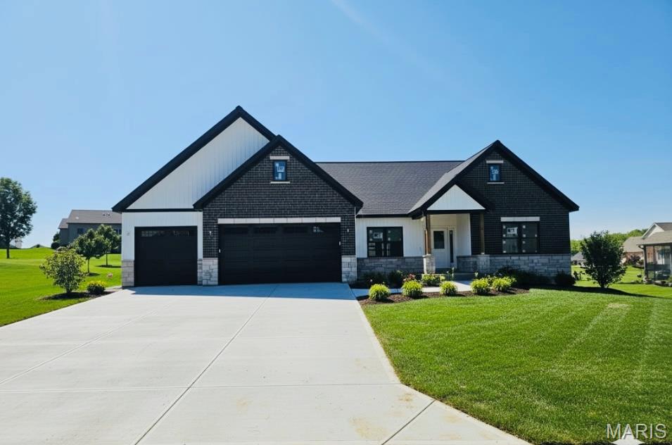 Exceptional Craftsman ranch in Troy’s highly desirable Westborough Estates, offering high-end finishes, thoughtful design, and a fully finished basement—scheduled for completion in July.
Designed for both everyday living and entertaining, the open-concept main level features a stunning chef’s kitchen with quartz countertops, butler’s pantry, oversized island with seating, gas range, and abundant cabinetry. The living room creates an impressive, light-filled focal point, while the coffered dining room adds a touch of elegance and architectural detail.
The primary suite is a true retreat, showcasing a coffered ceiling, expansive walk-in closet, and a spa-inspired en suite with double vanity, custom tile shower, and private water closet.
The finished basement expands your living space with a large recreation room, wet bar, two spacious bedrooms, and a full bath—ideal for guests, entertaining, or multi-generational living.
Step outside to a large rear patio overlooking the private, spacious backyard—perfect for hosting gatherings or relaxing evenings. An oversized 3-car garage provides ample room for vehicles, storage, and more.
A rare opportunity to own a beautifully crafted home in one of Troy’s most sought-after communities—this is one you don’t want to miss. Shown by appointment only. FHA/VA financing available with a One-Year Builder Warranty. Owner/Agent.