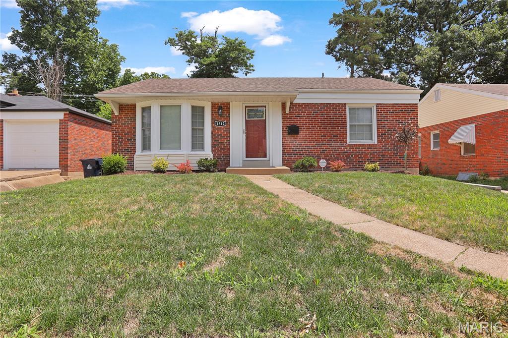 Welcome to your beautifully renovated 3-bedroom, 2-bath home, where modern updates and timeless charm come together. Move-in ready and thoughtfully remodeled, this home offers an inviting open floor plan with freshly painted interiors and beautifully refinished hardwood floors throughout with a finished lower level that provides valuable additional living space.

The stunning kitchen is designed for both everyday living and entertaining, featuring new stainless-steel appliances, 42-inch cabinetry, granite countertops, and a spacious center island. Just off the kitchen, you'll find a stylish wet bar with a built-in wine cooler, creating the perfect space for hosting family and friends.  The main-level bathroom has been completely renovated with a new spa-style soaking tub, modern vanity, toilet, and ceramic tile flooring. The lower-level bathroom showcases a beautifully finished walk-in shower that adds both comfort and luxury.

Major improvements include new electrical system, new plumbing, and new sump pump, providing added peace of mind. The furnace, central air conditioning, and water heater are all in excellent working condition.  Relax year-round in the all-glass four-season sunroom, an ideal space for enjoying your morning coffee, reading, or entertaining guests. Step outside to a fenced backyard that's perfect for children, pets, outdoor gatherings, and summer barbecues.

Conveniently located in the heart of University City, you'll enjoy quick access to shopping, dining, parks, Washington University, Clayton, Downtown St. Louis, and major highways.  This exceptional home combines quality updates, functional living space, and an unbeatable location—don't miss your opportunity to make it yours!