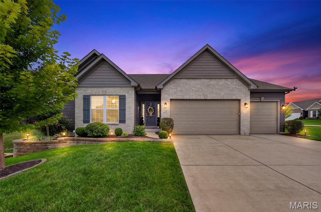 Experience refined living in the stunning 3-bedroom, 3.5-bath, ranch style home, perfectly situated in Lake St. Louis. Every inch of the home has been thoughtfully updated, blending elegance, functionality and luxury, all situated on a quiet street the Wentzville-Timberland school district. Sitting on 0.35+ of an acre, the spacious, fenced backyard, large patio w/ pergola, firepit and beautiful landscaping provide an excellent space to play and entertain. The gourmet kitchen is the centerpiece of the home, with granite counter tops, breakfast bar, custom cabinets, large walk-in pantry, contemporary lighting and high end stainless steel appliances with wall oven, gas range and refrigerator (included).  Beautiful luxury vinyl plank flooring flows throughout the home and upgraded plantation shutters provide privacy and style. The breakfast room and living room provide perfect areas to entertain and are accented by the 14 ft. vaulted ceilings and wood burning fireplace. The primary bedroom suite features overhead lighting/fan, plantation shutters, a large walk-in closet and a beautiful primary bathroom w/ dual vanities and spacious shower. You will find 2 additional bedrooms on the main level that feature a jack-and-jill bathroom and also an additional 1/2 bath, entry foyer and spacious laundry room.  The lower level is unfinished, but does have a full, luxury bathroom already in place! Additional features include a 9 ft basement foundation, irrigation system, expanded 3 car garage, water softener, architectural shingle roof and beautiful outdoor landscaping. If you've been dreaming of modern updates that deliver both grander and warmth, this property delivers unmatched quality and comfort that you will enjoy for years to come!