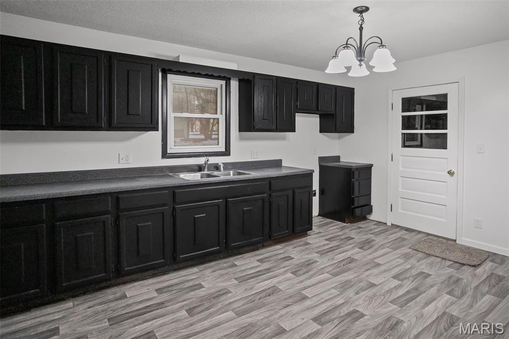 Motivated Sellers!! Welcome to this recently remodeled 3-bedroom, 1 bath home located in a quiet subdivision on the hill in Pleasant Hill at 106 Lyndel Road!  This home offers the convenience of all main level living, featuring three bedrooms, a full bath, and a dedicated utility room.  Recent updates include fresh interior paint, all new flooring, new light fixtures, and an updated bathroom, giving the home a clean, modern feel throughout. A metal roof adds long term value and peace of mind.  Outside, you'll find a one car attached garage and an additional storage shed for tools, lawn equipment, or extra storage.  This home is truly move in ready and perfect for first time buyers, those looking to downsize, or anyone wanting affordable, updated living!