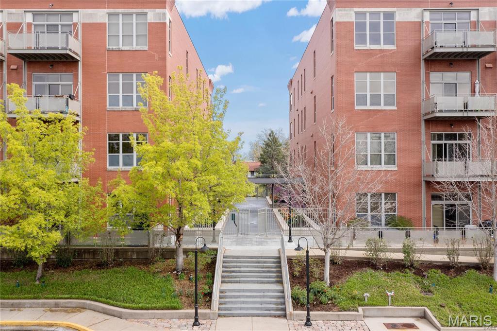 Be WOWED by this Sophisticated & Stylish Fully Renovated 2 bed + 2 full bath condo in the the highly desirable Hi Pointe Lofts in Clayton! Open floor plan w/ 11’ ceilings, hardwood floors, 9’ windows & glass partition panels bring NYC / L.A vibes! A gallery entry leads you into the open floor plan, effortlessly leading to a private elevated terrace. The large open kitchen features custom cabinetry, granite countertops, pantry, SS appliances & gas range. Stunning master suite w/ walk in closet & renovated master bath w/ oversized tile shower, dual vanities & separate soaking tub. Custom sliding barn doors separate the 2nd bedroom w/ great access to the renovated 2nd full bath. A walk in laundry room & dedicated 2 garage spaces in the heated underground garage w/ extra storage are functional delights. Clayton schools, walkable to Forest Park & all DeMun has to offer! Great highway access & minutes from downtown Clayton, Cortex, SLU, Washington University & BJC. An amazing opportunity!
