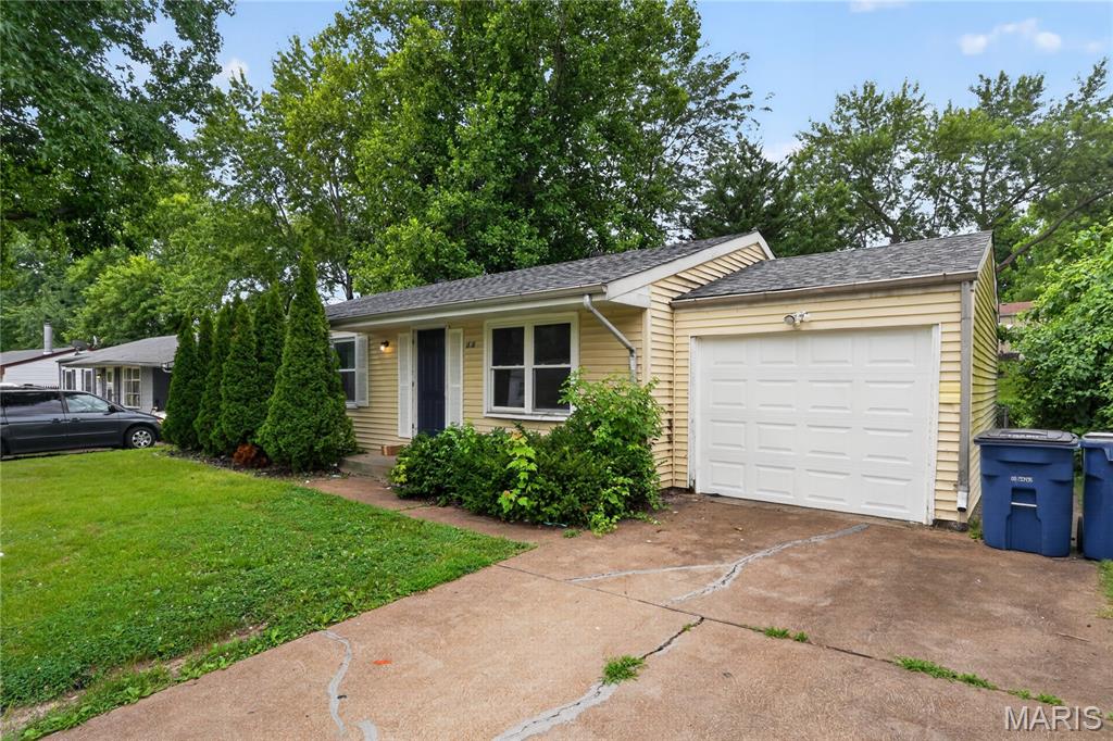 Welcome home to this charming 3-bedroom, 1-bath ranch offering comfortable one-level living. Inside, you'll find a bright living area with a cozy fireplace, an eat-in kitchen, and hardwood flooring in the bedrooms. Fresh interior paint adds a clean, updated feel throughout. The full walkout basement provides excellent storage or future finishing potential. Outside, enjoy a detached garage, patio, and spacious backyard perfect for relaxing or entertaining. Conveniently located near shopping, dining, parks, and major highways.